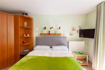 Ein Bett oder Betten in einem Zimmer der Unterkunft Apartment an der Wurmbergseilbahn mit Balkon