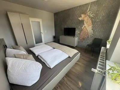 Ein Bett oder Betten in einem Zimmer der Unterkunft Stilapartment Oasis 2