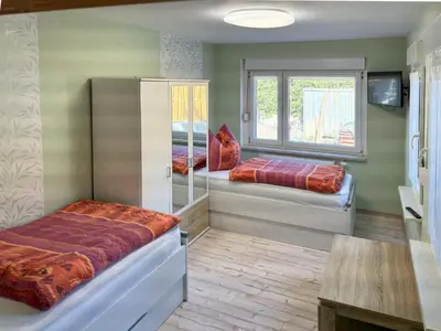 Ein Bett oder Betten in einem Zimmer der Unterkunft Zur Teufelsmauer