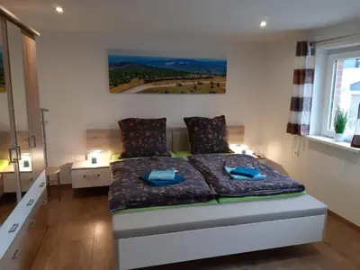 Ein Bett oder Betten in einem Zimmer der Unterkunft Ferienhaus LeBen