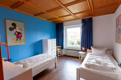 Ein Bett oder Betten in einem Zimmer der Unterkunft Ferienwohnung Carpe Diem mit Balkon