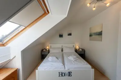 Ein Bett oder Betten in einem Zimmer der Unterkunft Ferienwohnung Panoramablick mit Balkon