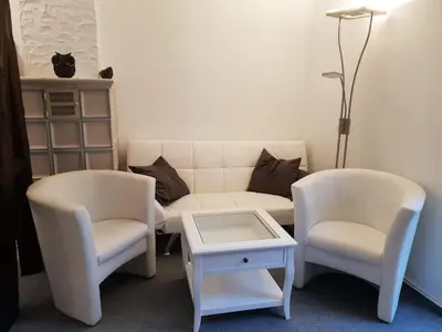 Ein Sitzbereich in der Unterkunft Ferienhaus Färber