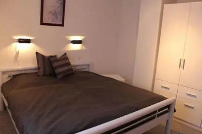 Ein Bett oder Betten in einem Zimmer der Unterkunft Ferienwohnung Arlt