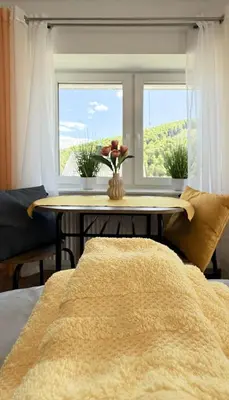 Ein Bett oder Betten in einem Zimmer der Unterkunft Villa Palmwiesen