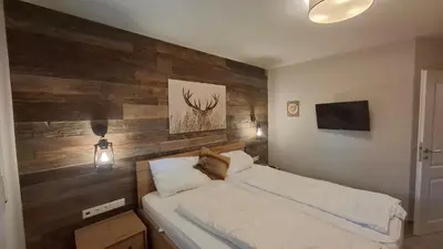 Ein Bett oder Betten in einem Zimmer der Unterkunft Ferienwohnung Kurparkglück