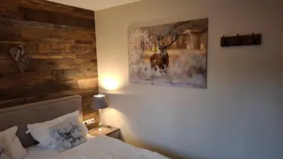 Ein Bett oder Betten in einem Zimmer der Unterkunft Ferienwohnung Kurparkglück