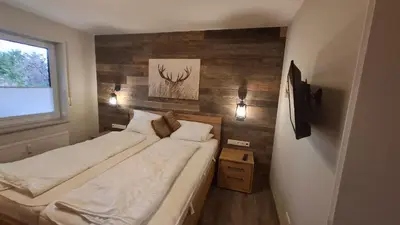 Ein Bett oder Betten in einem Zimmer der Unterkunft Ferienwohnung Kurparkglück