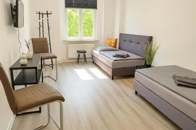 Ein Bett oder Betten in einem Zimmer der Unterkunft Zentrumsnah, 4 Zi, WLAN, 7 P