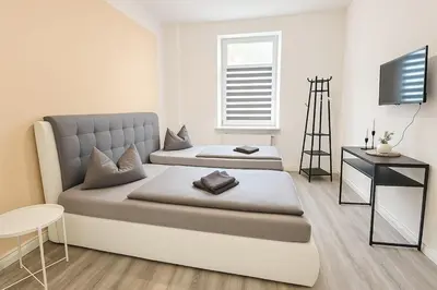 Ein Bett oder Betten in einem Zimmer der Unterkunft Zentrumsnah, 4 Zi, WLAN, 7 P