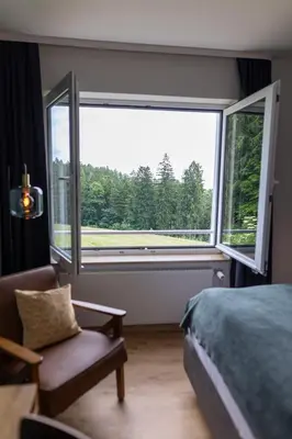 Ein Bett oder Betten in einem Zimmer der Unterkunft Luchs Quartier Hahnenklee