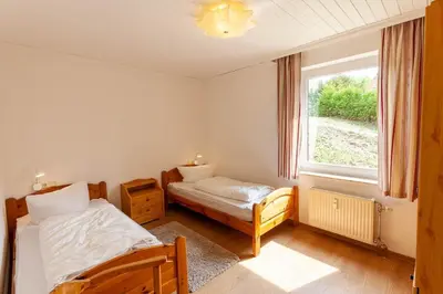 Ein Bett oder Betten in einem Zimmer der Unterkunft Ferienwohnung Mohn
