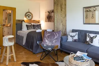 Ein Bett oder Betten in einem Zimmer der Unterkunft Ferienwohnung der Berg ruft