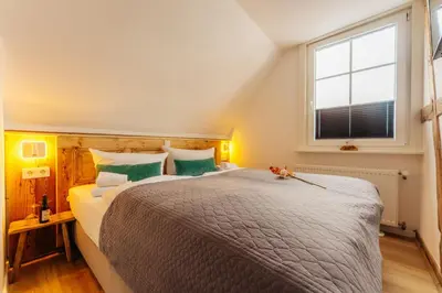 Ein Bett oder Betten in einem Zimmer der Unterkunft Gruppenhaus Rosenhof