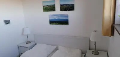 Ein Bett oder Betten in einem Zimmer der Unterkunft Apartment Weitsicht mit Pool & Sauna