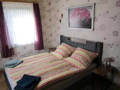 Ein Bett oder Betten in einem Zimmer der Unterkunft Ferienwohnung Steiger-Kaue am Rammelsberg