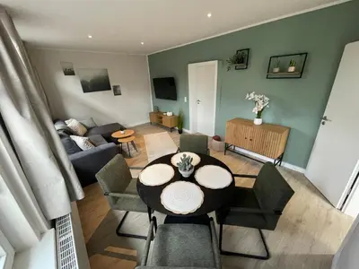 Ein Sitzbereich in der Unterkunft Cottage Cozy Gästehaus