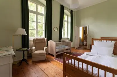 Ein Bett oder Betten in einem Zimmer der Unterkunft Gutshaus Mahndorf