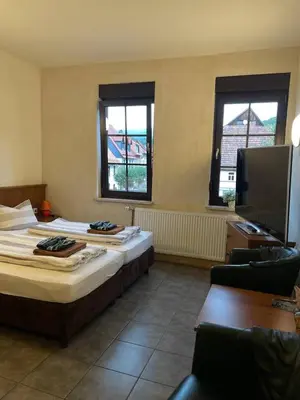 Ein Bett oder Betten in einem Zimmer der Unterkunft Ferienwohnungen am Roland