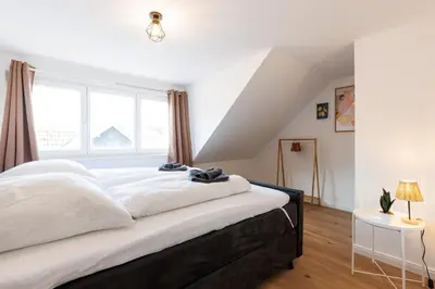 Ein Bett oder Betten in einem Zimmer der Unterkunft PrimeLoft 