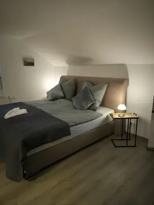 Ein Bett oder Betten in einem Zimmer der Unterkunft Ferienwohnung Am Sonnenbrink