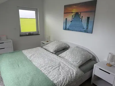 Ein Bett oder Betten in einem Zimmer der Unterkunft Ferienwohnung Am Teufelsmauerstieg