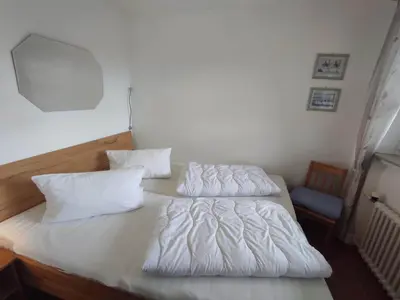 Ein Bett oder Betten in einem Zimmer der Unterkunft Ferienwohnung Schüler - Wolke 1