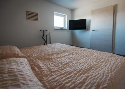 Ein Bett oder Betten in einem Zimmer der Unterkunft Ferienhaus Zur Lore 13