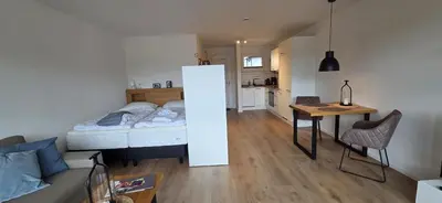 Ein Bett oder Betten in einem Zimmer der Unterkunft Theos
