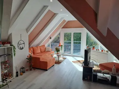 Ein Sitzbereich in der Unterkunft DESIGN-LOFT Brockenblick -Netflix-Smart TV-WLAN-Wallbox-Kaffeevollautomat-Balkon- Panoramaaussicht-Getränke-Pizza-Snacks