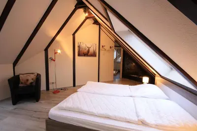 Ein Bett oder Betten in einem Zimmer der Unterkunft Ferienwohnung Zauberhirsch