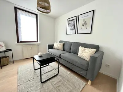 Ein Sitzbereich in der Unterkunft Modernes Apartment am Campus II