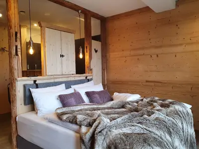 Ein Bett oder Betten in einem Zimmer der Unterkunft WLodgeOne - Wald Lodge