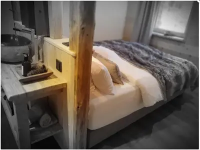 Ein Bett oder Betten in einem Zimmer der Unterkunft WLodgeOne - Wald Lodge