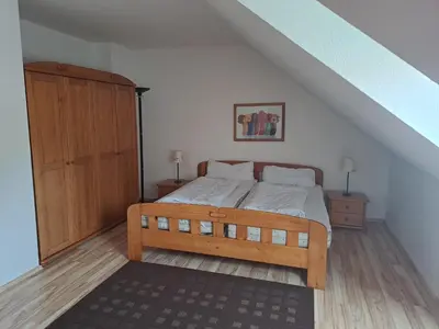 Ein Bett oder Betten in einem Zimmer der Unterkunft Ferienwohnung An der Wurmbergseilbahn