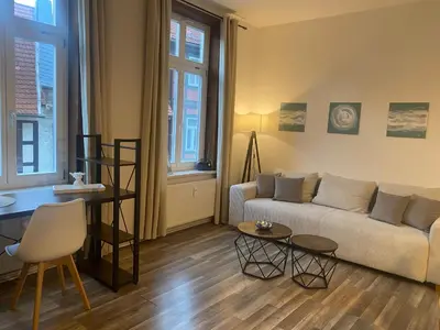 Ein Sitzbereich in der Unterkunft BeyerAppartements- Suite für 4 - Innenstadt- SmartTV- Küchenzeile- Espresso Maschine- Waschmaschine- Schlafcouch