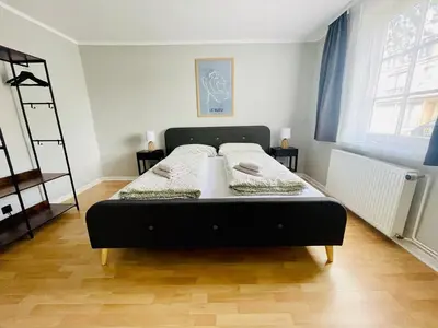 Ein Bett oder Betten in einem Zimmer der Unterkunft Fundis Apartment am Schloss