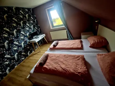 Ein Bett oder Betten in einem Zimmer der Unterkunft CS HARZgeflüster-Das Familienhotel
