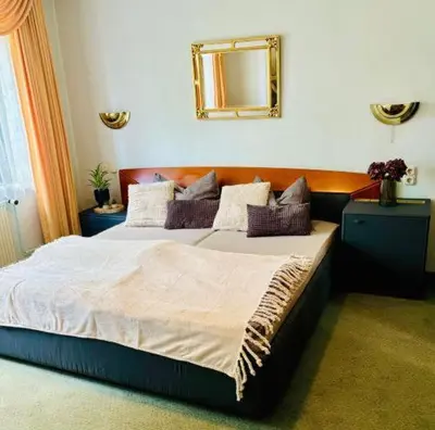 Ein Bett oder Betten in einem Zimmer der Unterkunft CS HARZgeflüster-Das Familienhotel
