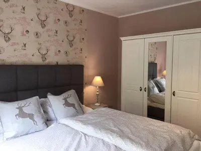 Ein Bett oder Betten in einem Zimmer der Unterkunft Familien-Nest 
