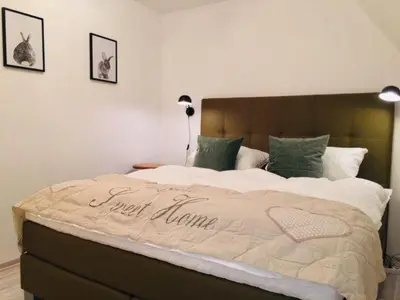 Ein Bett oder Betten in einem Zimmer der Unterkunft Ferienhaus Sehnsucht-Harz 
