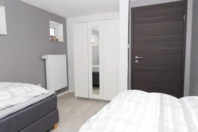 Ein Bett oder Betten in einem Zimmer der Unterkunft Ferienhaus Urlaubsreich