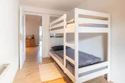 Ein Bett oder Betten in einem Zimmer der Unterkunft Ferienwohnung am Nicolaiplatz