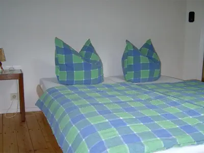 Ein Bett oder Betten in einem Zimmer der Unterkunft Waldhaus