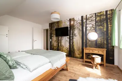 Ein Bett oder Betten in einem Zimmer der Unterkunft FH HarzHirsch - Kamin, Sauna, Bettwäsche, Kurtaxe inklusive