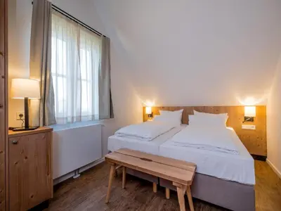 Ein Bett oder Betten in einem Zimmer der Unterkunft Ferienhäuser, Torfhaus Harz