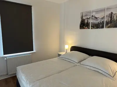 Ein Bett oder Betten in einem Zimmer der Unterkunft Ferienwohnung Mauerperle
