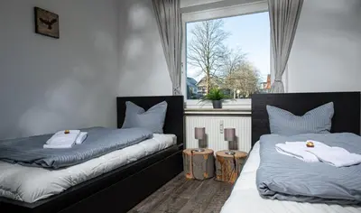 Ein Bett oder Betten in einem Zimmer der Unterkunft Gemütliches Chalet-Apartment Harzglück am Fuß des Berges