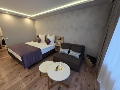 Ein Bett oder Betten in einem Zimmer der Unterkunft TeMax Lux Hahnenklee