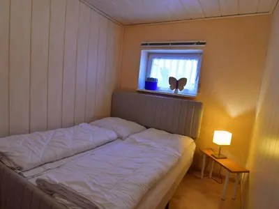 Ein Bett oder Betten in einem Zimmer der Unterkunft Apartment mit Garten und Spielplatznutzung by Interhome